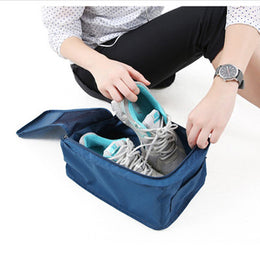 SoraCool Wet/Dry Travel Shoe Bag navy being packed with shoes