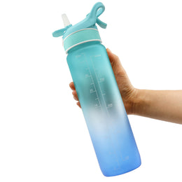 SoraCool Time-Marker Mist Water Bottle — teal-blue bottle held in a hand on a pale blue background