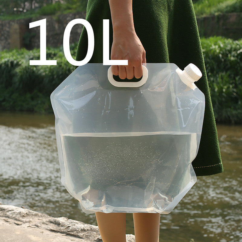 SoraCool Foldable Water Carrier — clear water carrier held by its handle outdoors with a ten-liter label