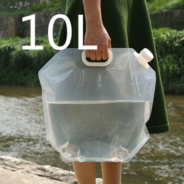SoraCool Foldable Water Carrier — clear water carrier held by its handle outdoors with a ten-liter label