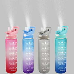 SoraCool Time-Marker Mist Water Bottle — pink, blue-purple, gray and teal bottles standing on a gray studio background